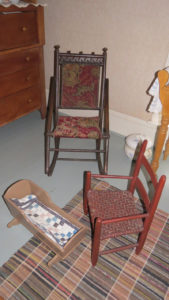 Toy cradle for a doll and child's chair